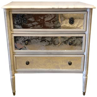 Marble-Top Hollywood Regency Decorated Commode Nightstand in Manner of Jansen: A Hollywood Regency style marble-top paint and Mylar decorated commode or nightstand in the Louis XVI style possibly by Maison Jansen. Dimensions: Height: 32.25 in (81.92 cm)Width: 30 in (76.2