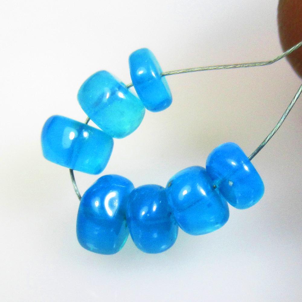 4.74 Ctw Natural 7 Drilled Neon Blue Fire Opal Beads: No Reserve! Title: 4.74 Ctw Natural 7 Drilled Neon Blue Fire Opal Beads Stone Clarity: Translucent Gemstones: Natural Opal Beads Carat Weights: 4.74 Size/Dimensions: 5.40 to 6.80 mm / 7 PC's Additiona