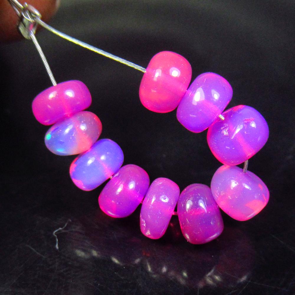 4.60 Ctw Natural 10 Drilled Pink Fire Opal Beads: No Reserve! Title: 4.60 Ctw Natural 10 Drilled Pink Fire Opal Beads Stone Clarity: Transparent Gemstones: Natural Pink Opal Beads Carat Weights: 4.60 Size/Dimensions: 5.10 to 5.40 mm / 10 PC's Additio
