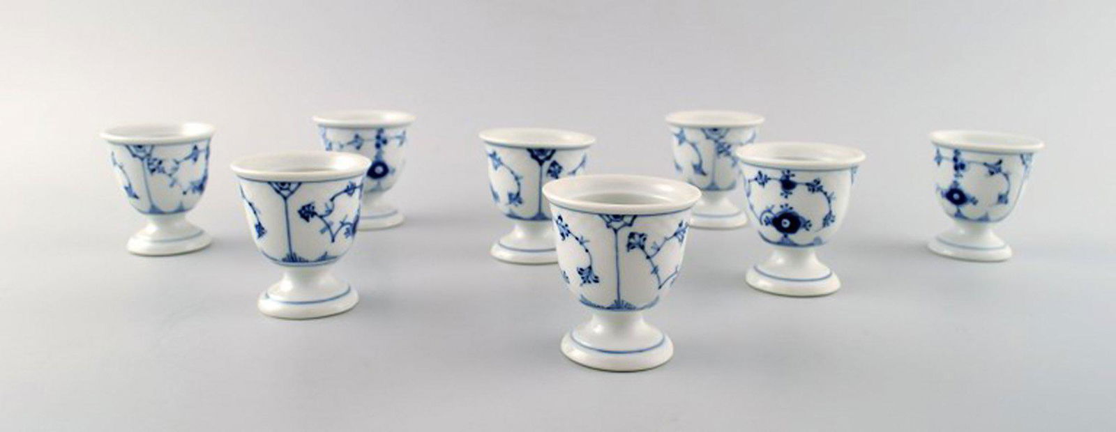 Bing & Grondahl / B&G blue fluted porcelain egg cups. 4 pcs. in stock.: Bing & Grondahl / B&G blue fluted, 4 porcelain egg cups. Measures: 6 cm x 5.2 cm. In perfect condition. 1st. assortment. Reserve: $35.00 Shipping: Domestic: Shipping rates are determined by destinatio