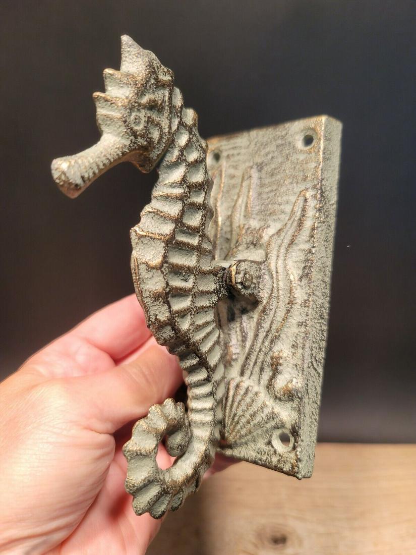 Cast Iron Seahorse Coastal Door Knocker: 5 1/2" Tall x 2 1/2" wide Nice heavy quality antique style cast iron door knocker! As you can see this is s heavy duty door seahorse knocker. The seahorse itself rocks and serves as the knocker. Notic