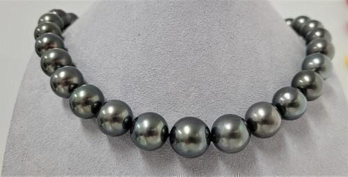 Huge 11x14mm Peacock Tahitian Pearls - Necklace: Title: Huge 11x14mm Peacock Tahitian Pearls - Necklace Size: 44cm Addl. Info: A luxury pearl necklace, made with lustrous round Tahitian pearls, and completed with a solid invisible clasp. Tahitian pe