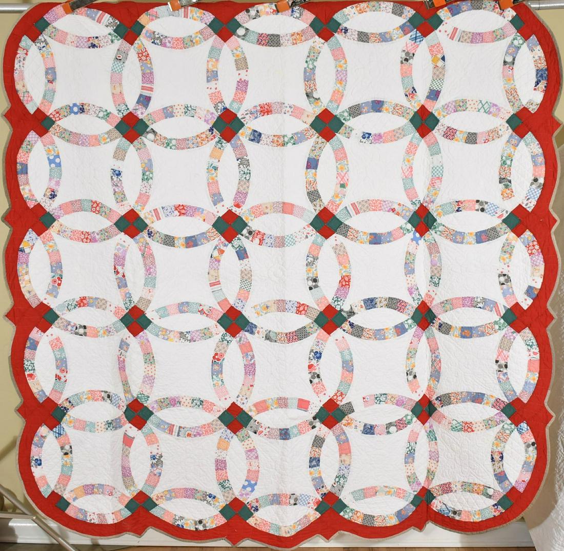 30's Double Wedding Ring Quilt, Red Border: Title: 30's Double Wedding Ring Quilt, Red Border Date: 1930's Origin: Ohio Material: Cotton Dimension [INCHES]: 76" X 76" Provenance: Cotton 20's / 30's double wedding ring quilt, all hand pieced and