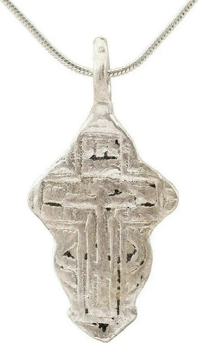EASTERN EUROPEAN CHRISTIAN CROSS, 17-18 C: Silvered bronze. Over 1 1/2" total height with elegant Baroque suspension loop. Raised border delineating the cross with broad beams, the cross beam above center and enclosing a stick cross with Cyril