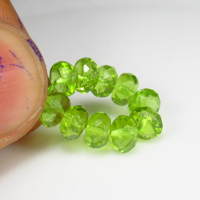 Natural Green Peridot Beads - 8.47 Ct: No Reserve! Title: Natural Green Peridot Beads - 8.47 Ct Origin: Pakistan Weight: 8.47 Size/Dimensions: 5.0 - 5.3 mm Additional Information: Pieces : 10 No's / Shape : Round Beads / Color : Green / Cl