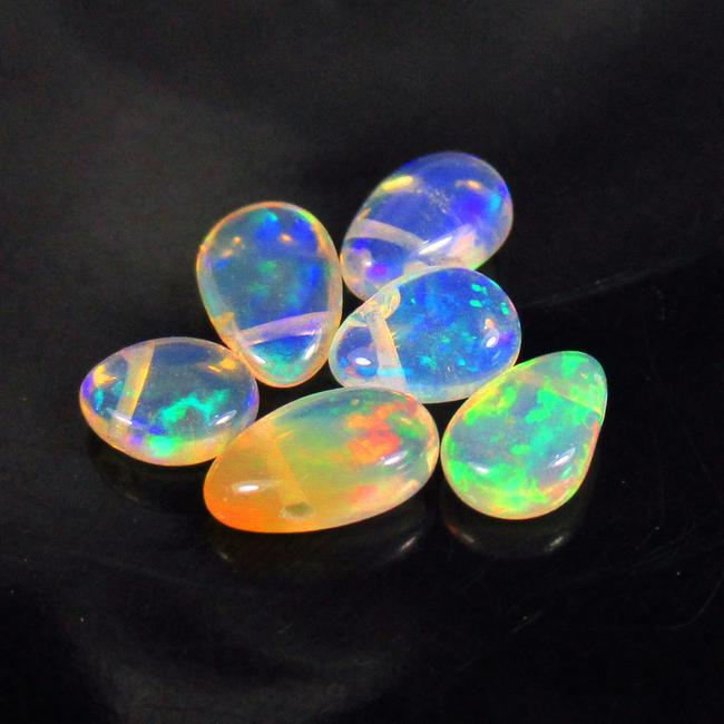 2.05 Ctw Natural 6 Drilled Multi-Color Fire Pear Opal beads: No Reserve! Title: 2.05 Ctw Natural 6 Drilled Multi-Color Fire Pear Opal beads Stone Clarity: Transparent Gemstones: Natural Opal Beads Carat Weights: 2.05 Size/Dimensions: 5.3x4.4 - 6.8x4.5 mm / 6 PC