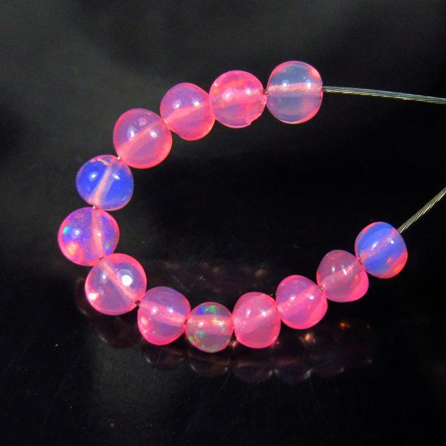 1.75 Ctw Natural 13 Drilled Pink Fire Opal Beads: No Reserve! Title: 1.75 Ctw Natural 13 Drilled Pink Fire Opal Beads Stone Clarity: Transparent Gemstones: Natural Opal Beads Carat Weights: 1.75 Size/Dimensions: 3.00 to 3.50 mm / 13 PC's Additional I