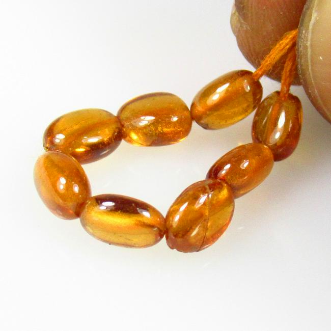 6.68 Ctw Natural Drilled Hessonite Garnet Oval Beads: No Reserve! Title: 6.68 Ctw Natural Drilled Hessonite Garnet Oval Beads Stone Clarity: Transparent Gemstones: Natural Hessonite Garnet Carat Weights: 6.68 Size/Dimensions: 5.80 x 4.10 - 6.70 x 4.60 mm