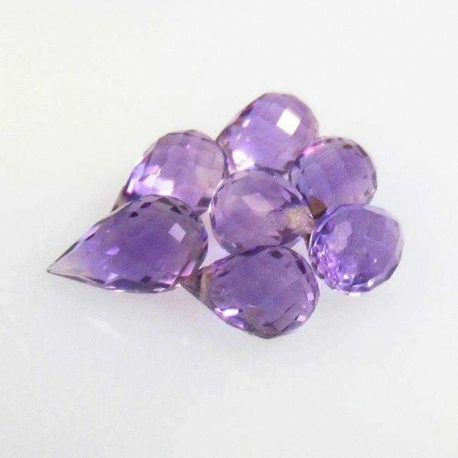 6.22 Ctw Natural 7 Drilled Purple Amethyst Pear Drop Beads: No Reserve! Title: 6.22 Ctw Natural 7 Drilled Purple Amethyst Pear Drop Beads Stone Clarity: Transparent Gemstones: Natural Amethyst Beads Carat Weights: 6.22 Size/Dimensions: 7.7x4.7 - 8.3x5.0 mm / 7