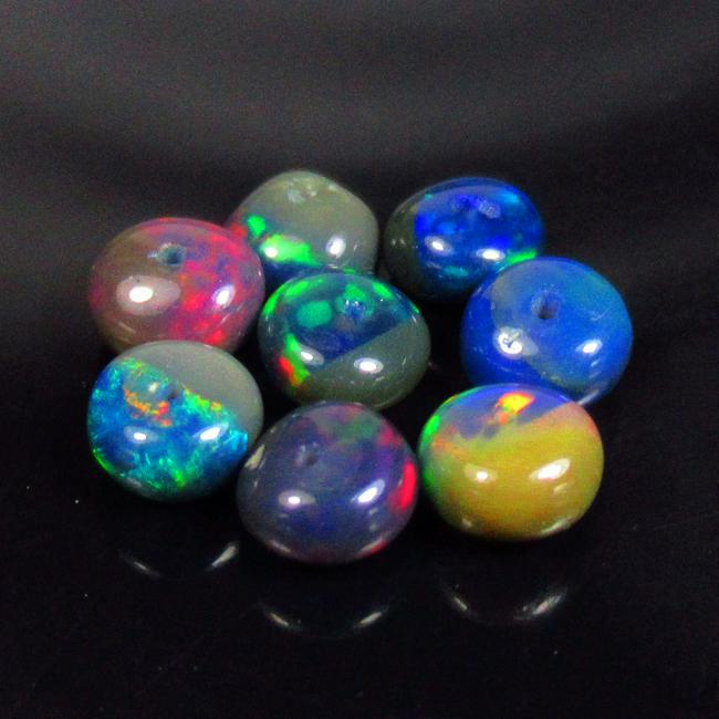 3.72 Ctw Natural 8 Drilled Black Fire Opal Round Beads: No Reserve! Title: 3.72 Ctw Natural 8 Drilled Black Fire Opal Round Beads Stone Clarity: Translucent Gemstones: Natural Black Opal Beads Carat Weights: 3.72 Size/Dimensions: 5.30 - 5.70 mm / 8 Pc's Ad