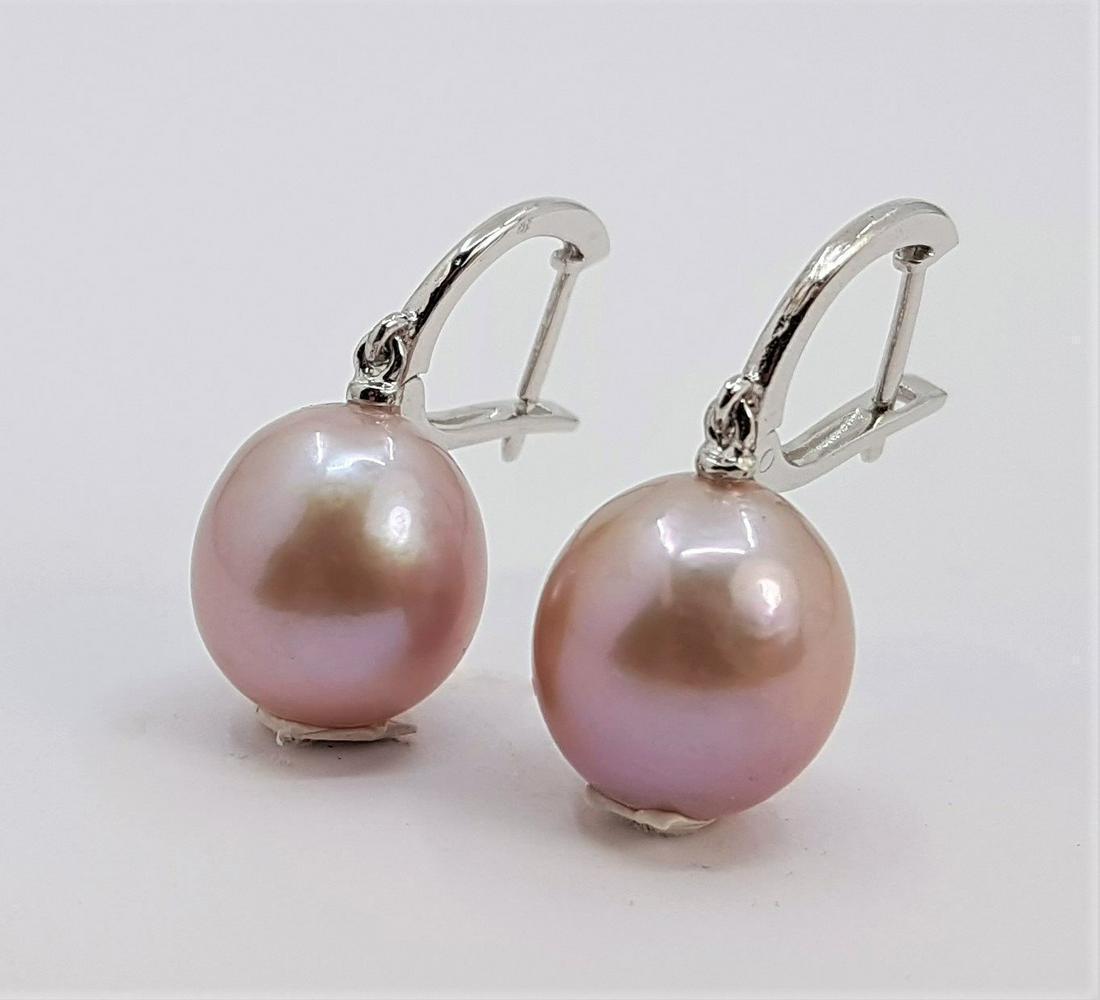 11x12mm Pink Edison Pearl Drops - 14 kt. White gold - Earrings: Title: 11x12mm Pink Edison Pearl Drops - 14 kt. White gold - Earrings Description: Produced by the Hyriupsis Cumingi oyster in the warm waters of Southeast Asia, these pearls have a natural beautiful 