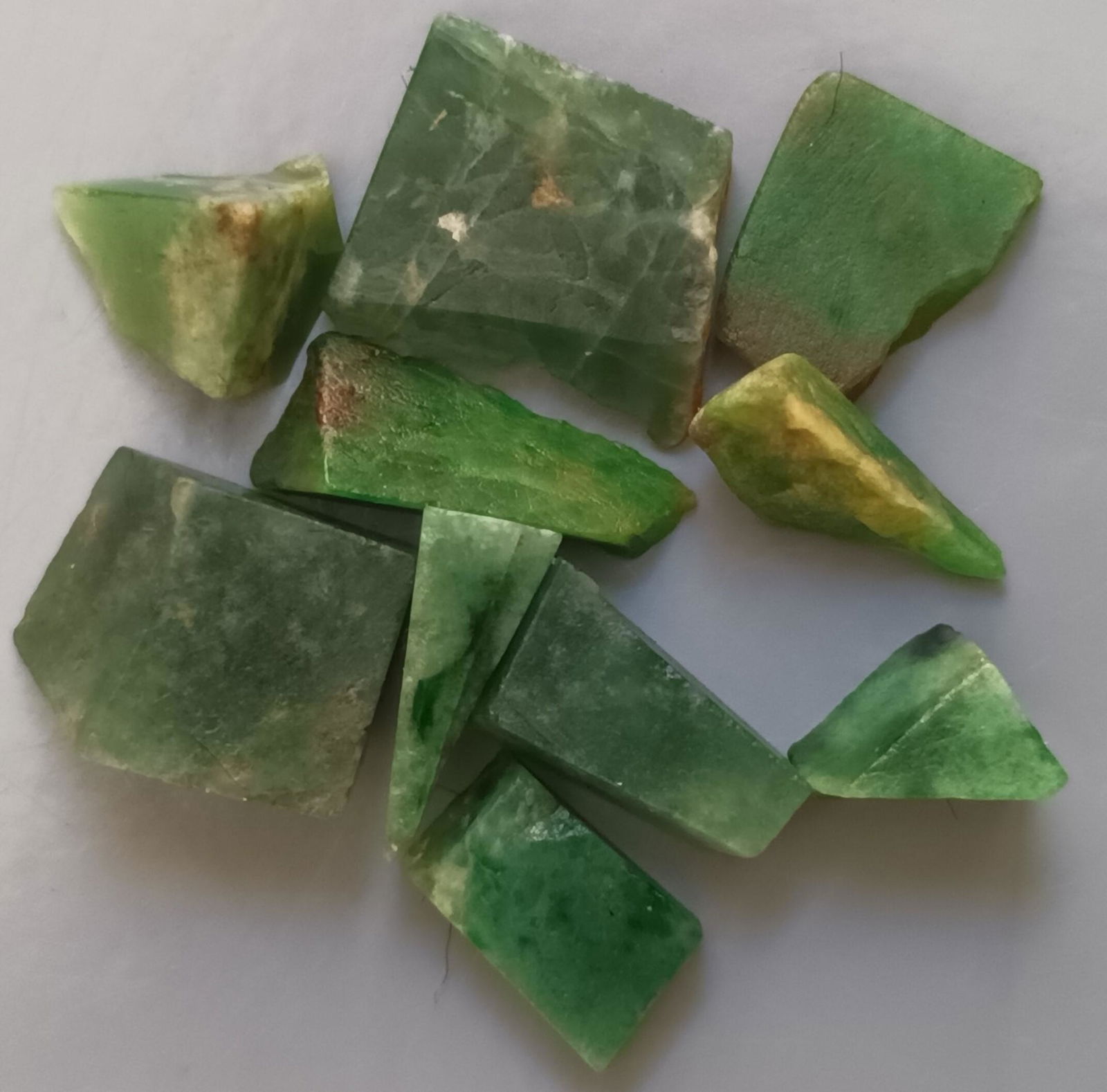 4.47 GRAM SET OF 10 DARK GREEN JADEITE JADE: Title: 4.47 GRAM SET OF 10 DARK GREEN JADEITE JADE Origin: Hpakant, Kachin State, Myanmar Size: 0.7x1.3 cm / 4.47 gram Description: set of 10 dark green jadeite jade cut pieces Reserve: $4.00 Shipping