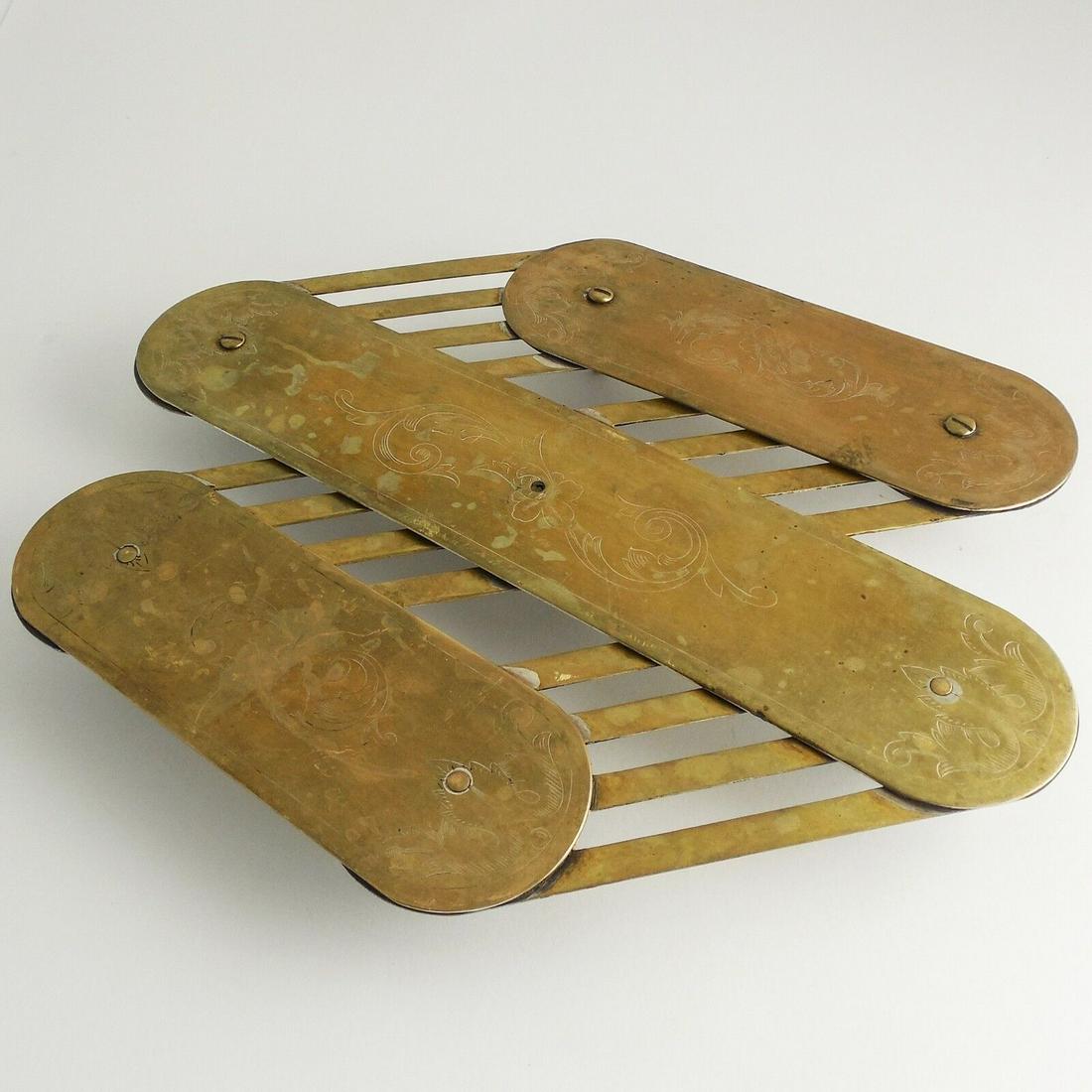 Antique 1800s Expanding Georgian Brass over Silverplate Trivet, ENGRAVED, Footed: RARE Antique 1800s Expanding Georgian Brass Plated over Silverplate Trivet, BEAUTIFULLY ENGRAVED, Articulated, Footed — GREAT PATINA Hallmarked (unreadable) ORIVET S.D.G.C. Approx. size: 8.50 in. WI