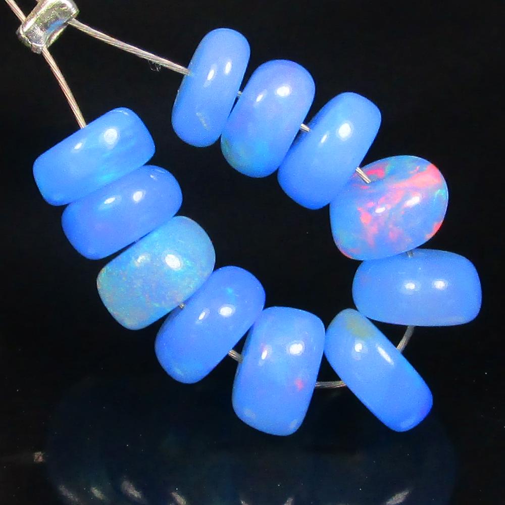3.65 Ctw Natural 11 Drilled Blue Fire Opal Beads: No Reserve! Title: 3.65 Ctw Natural 11 Drilled Blue Fire Opal Beads Stone Clarity: Transparent Gemstones: Natural Blue Opal Beads Carat Weights: 3.65 Size/Dimensions: 5.00 to 5.50 mm / 11 PC's Additio