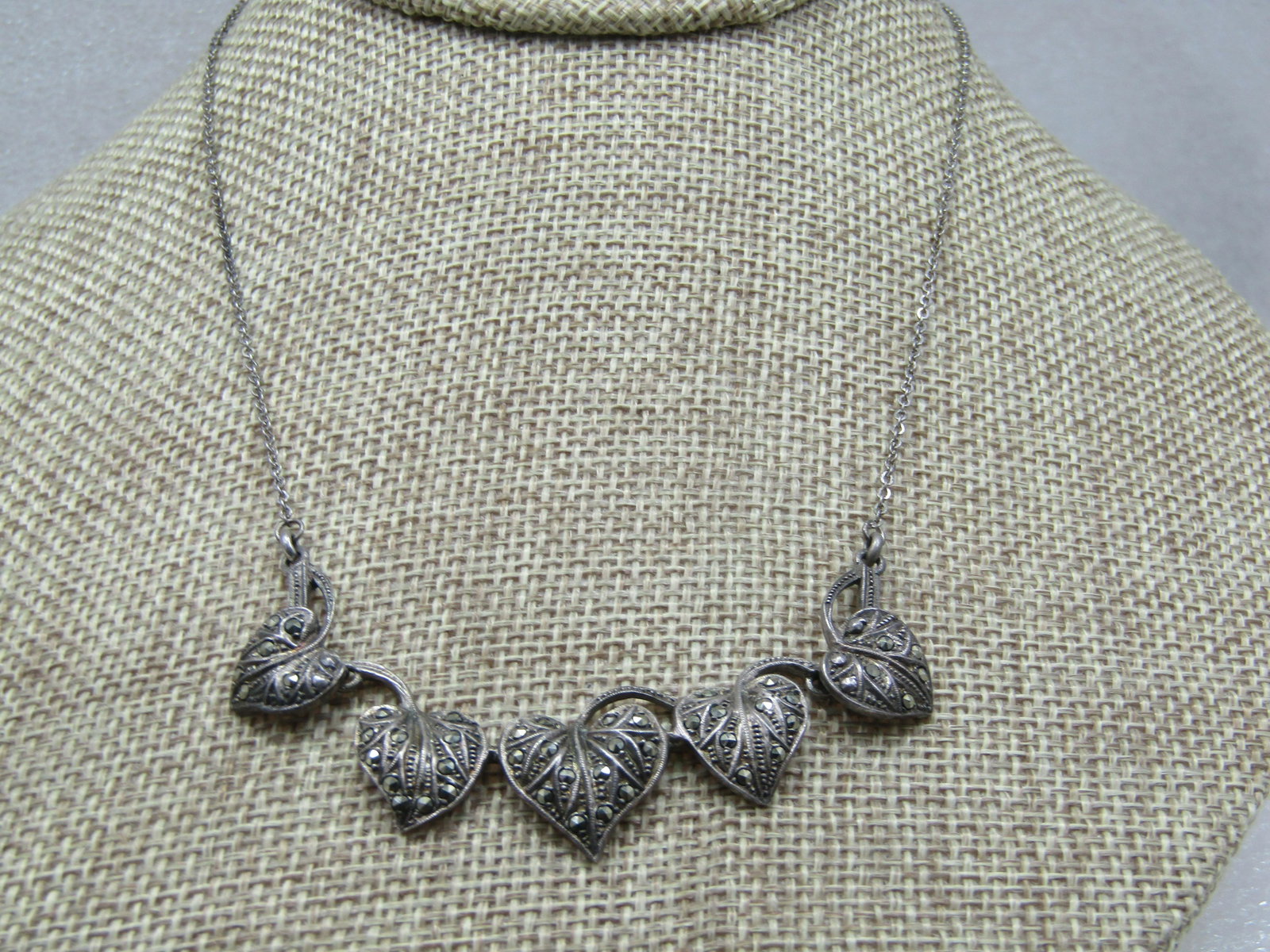 Vintage Sterling Marcasite Leaf Necklace, 17", Signed Birk, 1930's-1940's: Vintage Sterling Marcasite Leaf Necklace, 17", Signed Birks, 1930's-1940's. There are five slightly graduated leaves with stems across the front of the neck the are appx. 3" wide and range in drop fro