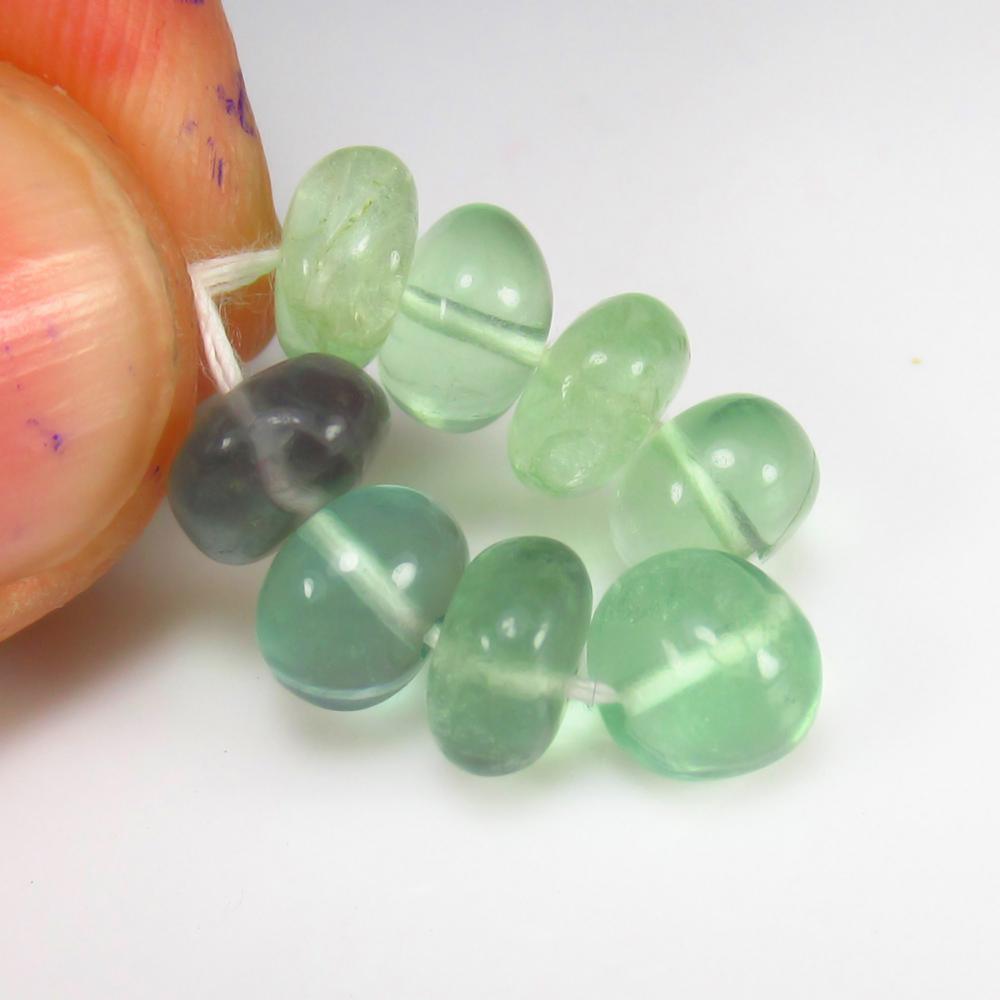 Natural Flourite Beads - 17.15 Ct: No Reserve! Title: Natural Flourite Beads - 17.15 Ct Origin: Brazil Weight: 17.15 Size/Dimensions: 7.0 - 7.4 mm Additional Information: Pieces : 8 No's / Shape : Drilled Round Beads / Color : Green / 