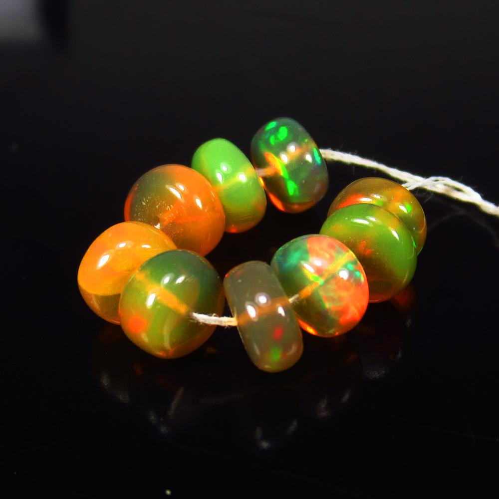 Natural Multicolor Opal Beads - 6.23 Ct: No Reserve! Title: Natural Multicolor Opal Beads - 6.23 Ct Origin: Ethiopia Weight: 6.23 Size/Dimensions: 6.0 - 6.4 mm Additional Information: Pieces : 9 No's / Shape : Drilled Round Beads / Clarity :