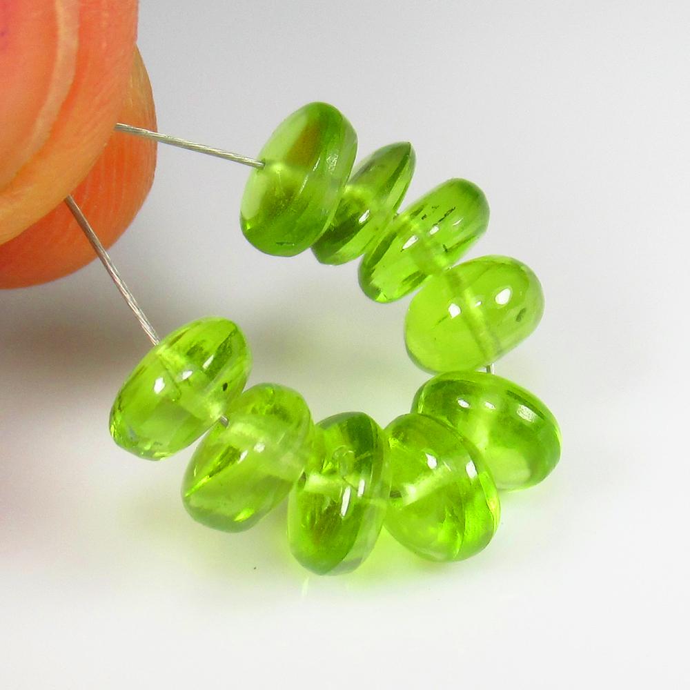 9.71 Ct - Natural Peridot Beads: No Reserve! Title: 9.71 Ct - Natural Peridot Beads Additional Information: Gemstone Gemstones: Peridot Beads Carat Weights: 9.71 Size/Dimensions: 6.0 - 6.3 mm Additional Information: Pieces : 9 No's /