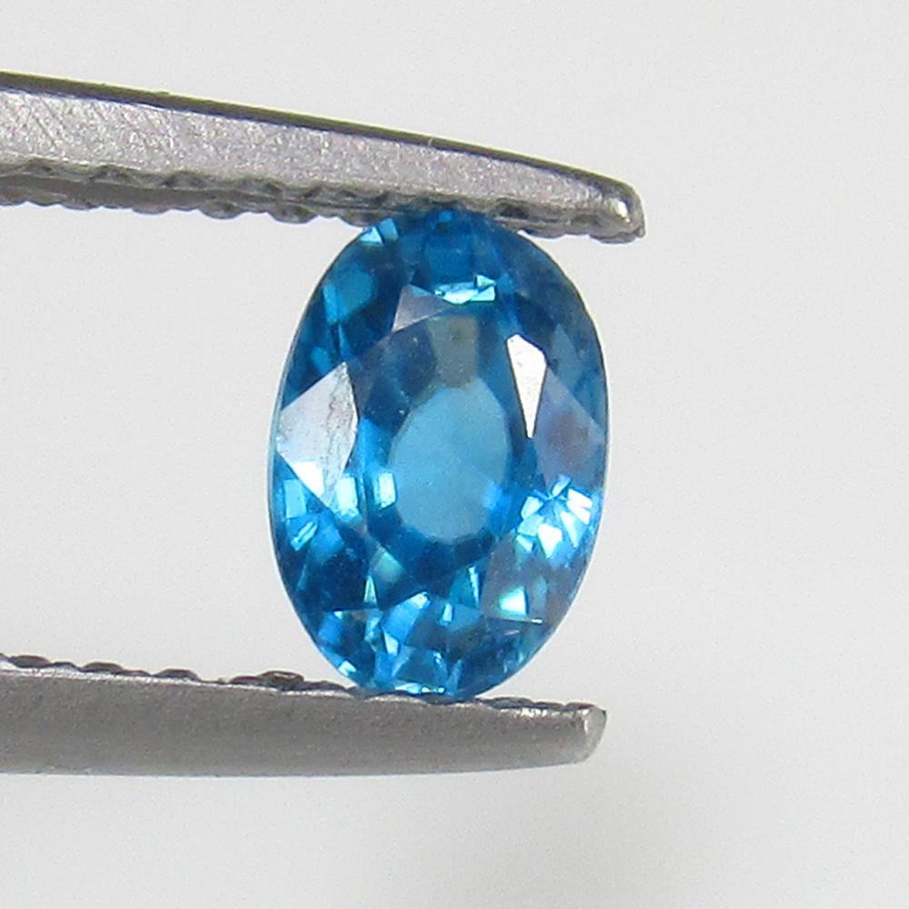 Natural Blue Zircon - 0.73 Ct: No Reserve! Title: Natural Blue Zircon - 0.73 Ct Origin: Combodia Weight: 0.73 Size/Dimensions: 5.7 x 4.0 x 3.0 mm Additional Information: Pieces : 1 No's / Shape : Oval Cut / Color : Blue / Clarity :