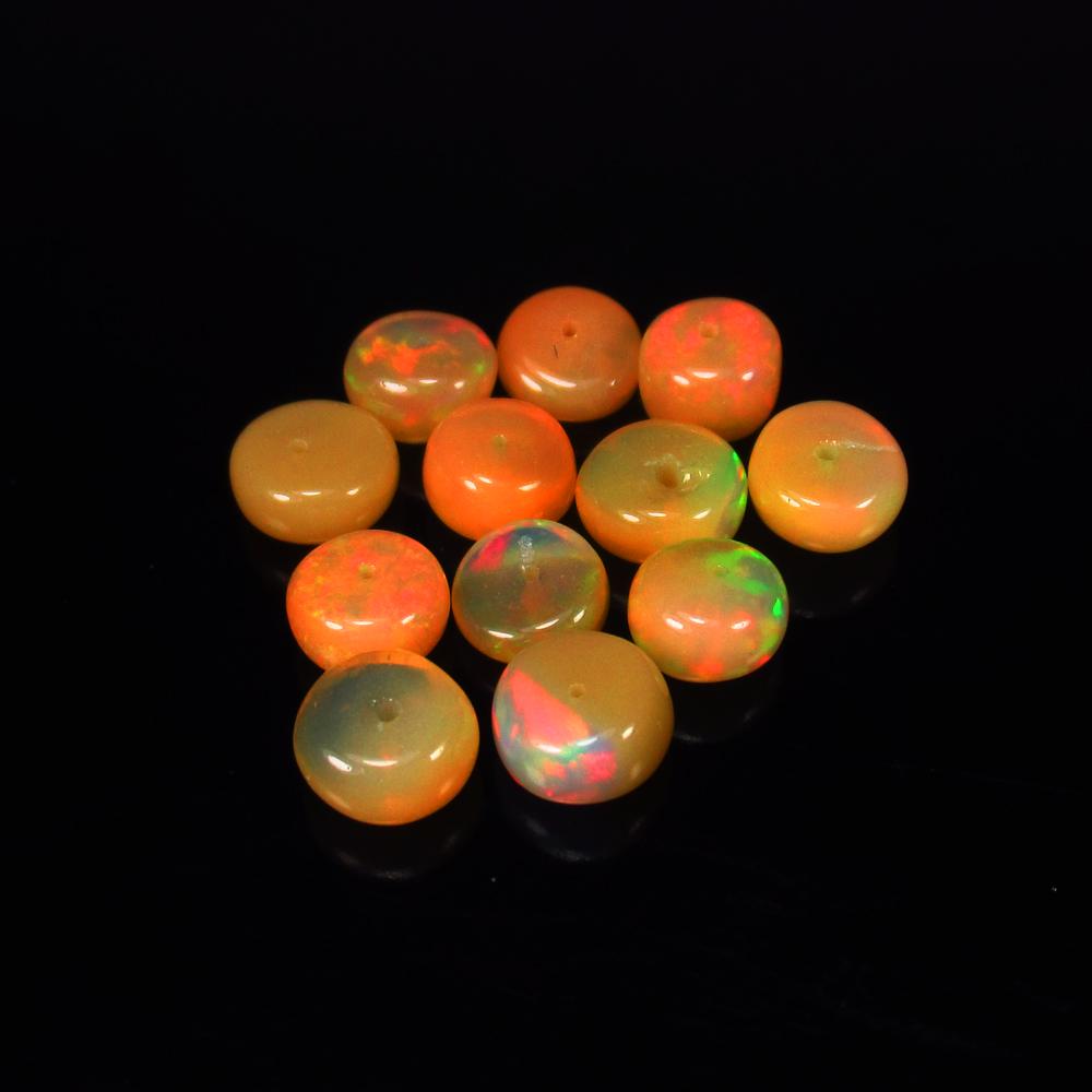 Natural Multicolor Opal Beads - 10.30 Ct: No Reserve! Title: Natural Multicolor Opal Beads - 10.30 Ct Origin: Ethiopia Weight: 10.30 Size/Dimensions: 6.3 - 7.0 mm Additional Information: Pieces : 12 No's / Shape : Drilled Round Beads / Clarit