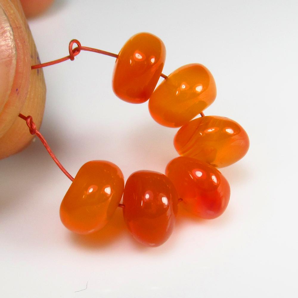 Natural Carnelian Beads - 10.89 Ct: No Reserve! Title: Natural Carnelian Beads - 10.89 Ct Origin: Brazil Weight: 10.89 Size/Dimensions: 7.1 - 7.4 mm Additional Information: Pieces : 6 No's / Shape : Drilled Round Beads / Color : Orange 