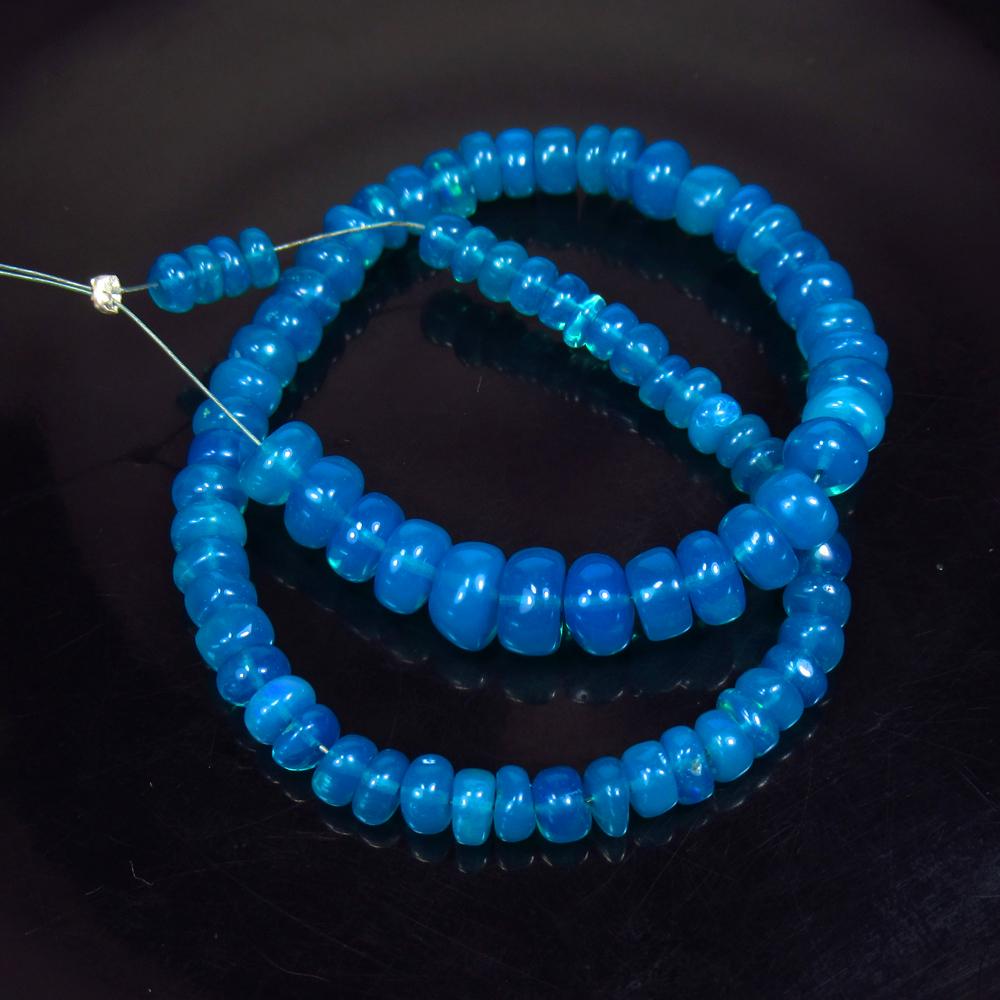 29.33 Ctw Natural 81 Drilled Neon Blue Fire Opal Beads: Title: 29.33 Ctw Natural 81 Drilled Neon Blue Fire Opal Beads Stone Clarity: Transparent Gemstone: Natural Opal Beads Carat Weight: 29.33 Dimensions: 4.10 to 6.80 mm / 81 PC's Additional Information: 
