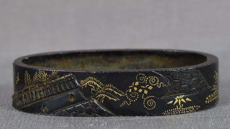 19c Japanese sword FUCHI temple rooftops: 18th to early 19th century Japanese sword fuchi (bordering piece between the sword guard and the handle) with relief design of several temple rooftops and overlaid gold details of deciduous trees, pin