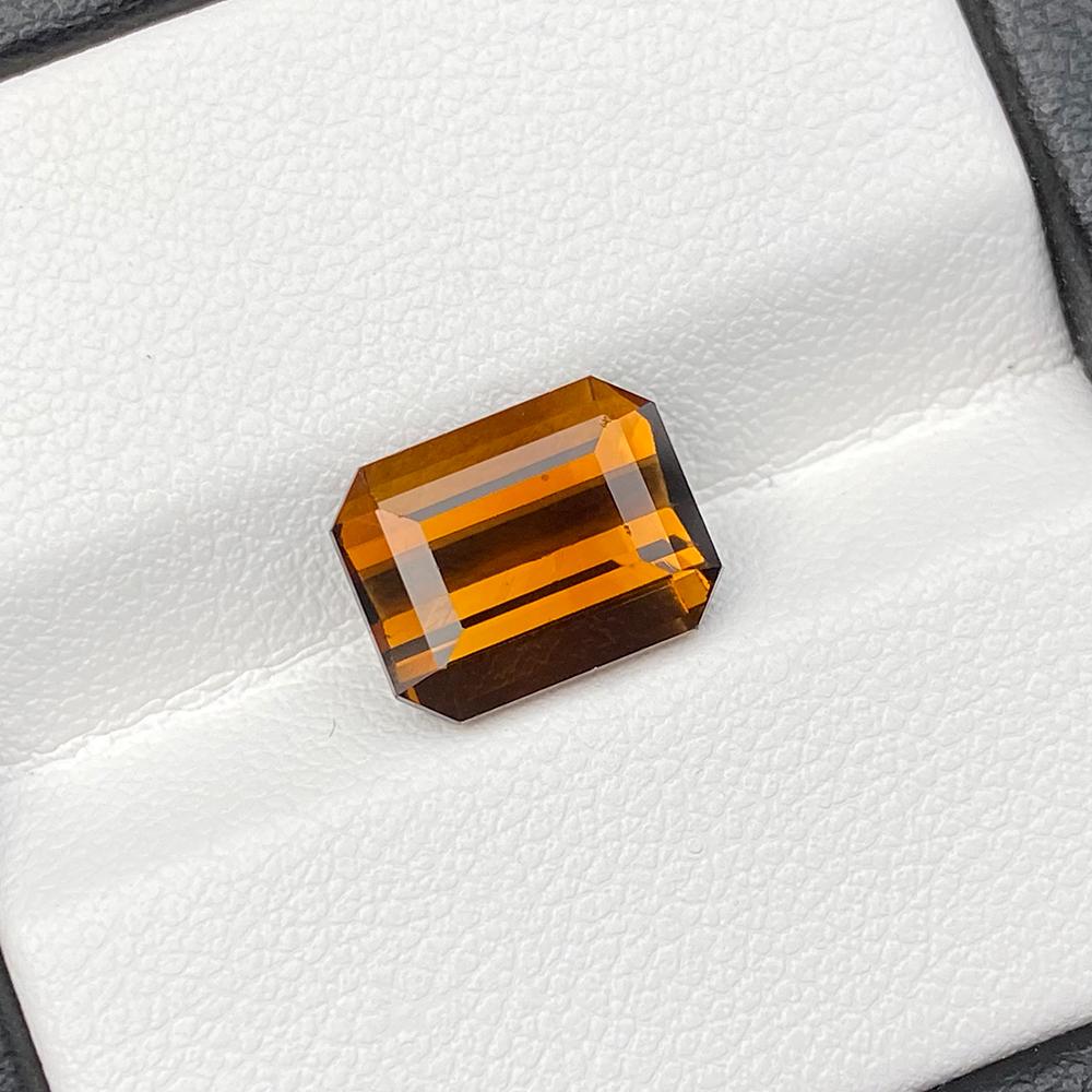 SRI LANKA BROWN TOURMALINE: Title: SRI LANKA BROWN TOURMALINE Additional Information: Variety/Type: Natural Tourmaline Shape: Emerald Dimension (L x W x D): 10.40MM X 8.20MM X 6.04MM Total Carat Weight (TCW): 4.35 Clarity: VVS T