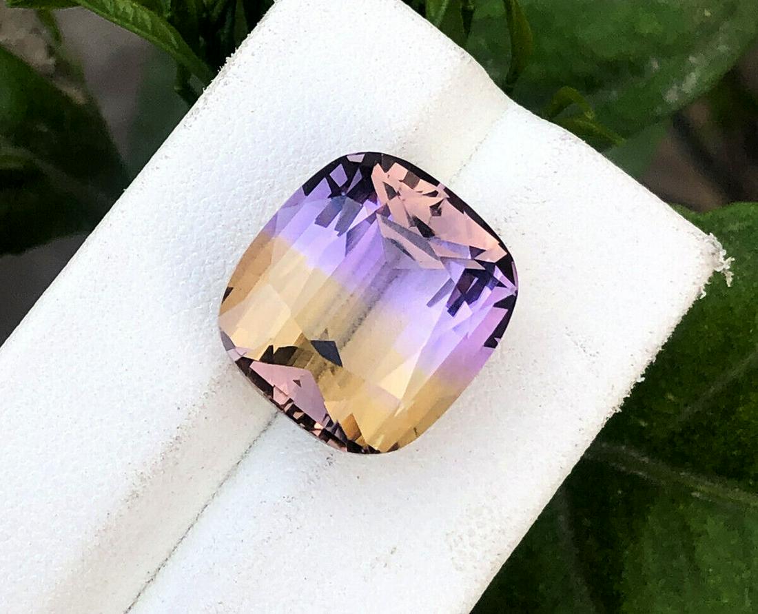 Ametrine, 19.45 Carats Natural Top Color Fancy Cut Ametrine Gemstone: Ametrine, 19.45 Carats Natural Top Color Fancy Cut Ametrine Gemstone - item NR911 ..... Dimensions (mm) 17 x 15 x 11 mm ..... Weight (carats) 19.45 carats ..... No Treatment = Natural Gemstone ..... R