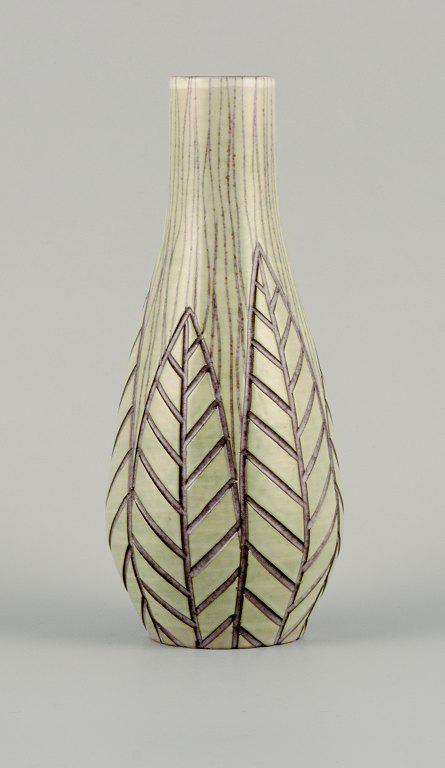 Mari Simmulson for Upsala Ekeby, "Rhodes" ceramic vase with leaves in relief.: Mari Simmulson for Upsala Ekeby, "Rhodes" ceramic vase with leaves in relief. Approx. 1950/60s. Stamped UE Sweden 4337 In excellent condition. Dimensions: D 9.0 x H 21.0 cm. Reserve: $280.00 Shipping: