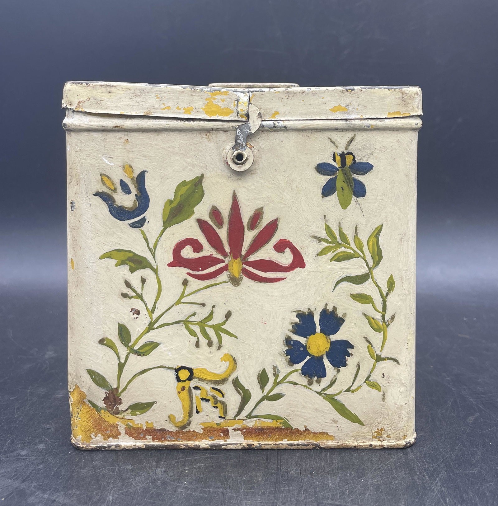 FOLK ART HAND PAINTED CRACKER TIN: Title: FOLK ART HAND PAINTED CRACKER TIN Date/Period: UNKNOWN Dimension: APPROX 5.25 X 5 X 4.75 Material: METAL Additional Information: FOLK ART HAND PAINTED CRACKER TIN Shipping: Domestic: Flat-rate 