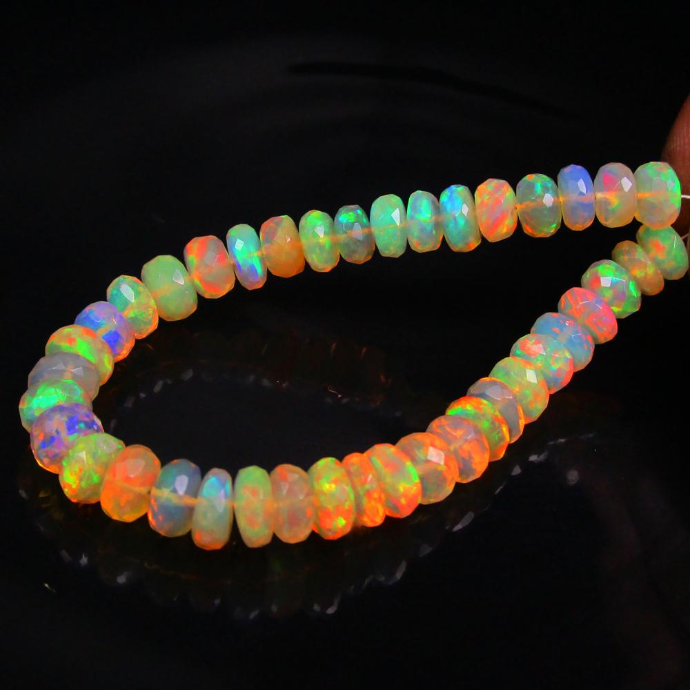 22.05 Ctw Natural 40 Drilled Multi-Color Fire Opal Round beads: Title: 22.05 Ctw Natural 40 Drilled Multi-Color Fire Opal Round beads Stone Clarity: Transparent Gemstones: Natural Opal Beads Carat Weights: 22.05 Size/Dimensions: 5.60 - 6.30 mm / 40 P'cs Additional