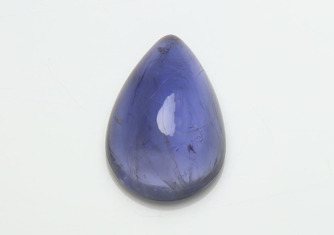 Stunning " Natural Iolite Violet " 3.46 Cts Natural Iolite: No Reserve! Title: Stunning " Natural Iolite Violet " 3.46 Cts Natural Iolite Additional Information: Gemstone : Natural Iolite Shape and Cut : Pear Cabochan Weight : 3.46 Carats Measuremets : 12.51x8