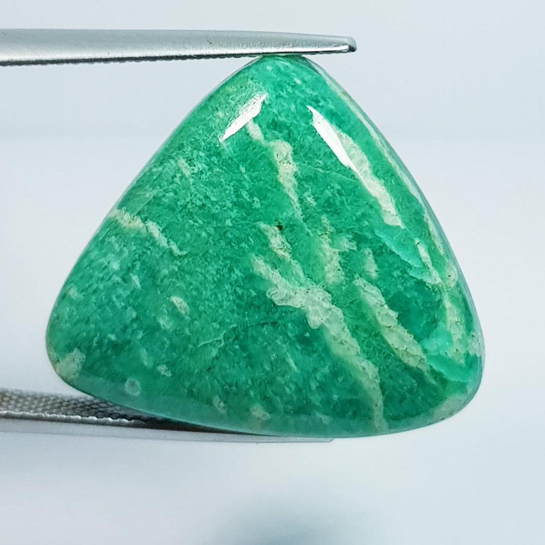 25.08 ctz Natural Amazonite: No Reserve! Title: 25.08 ctz Natural Amazonite Color/Clarity: Green / Opaque Gemstone: Amazonite Carat Weights: 25.08 Size: 28.60 x 15.95 x 7.70 Additional Information: Fancy / Brazil Shipping: Domest