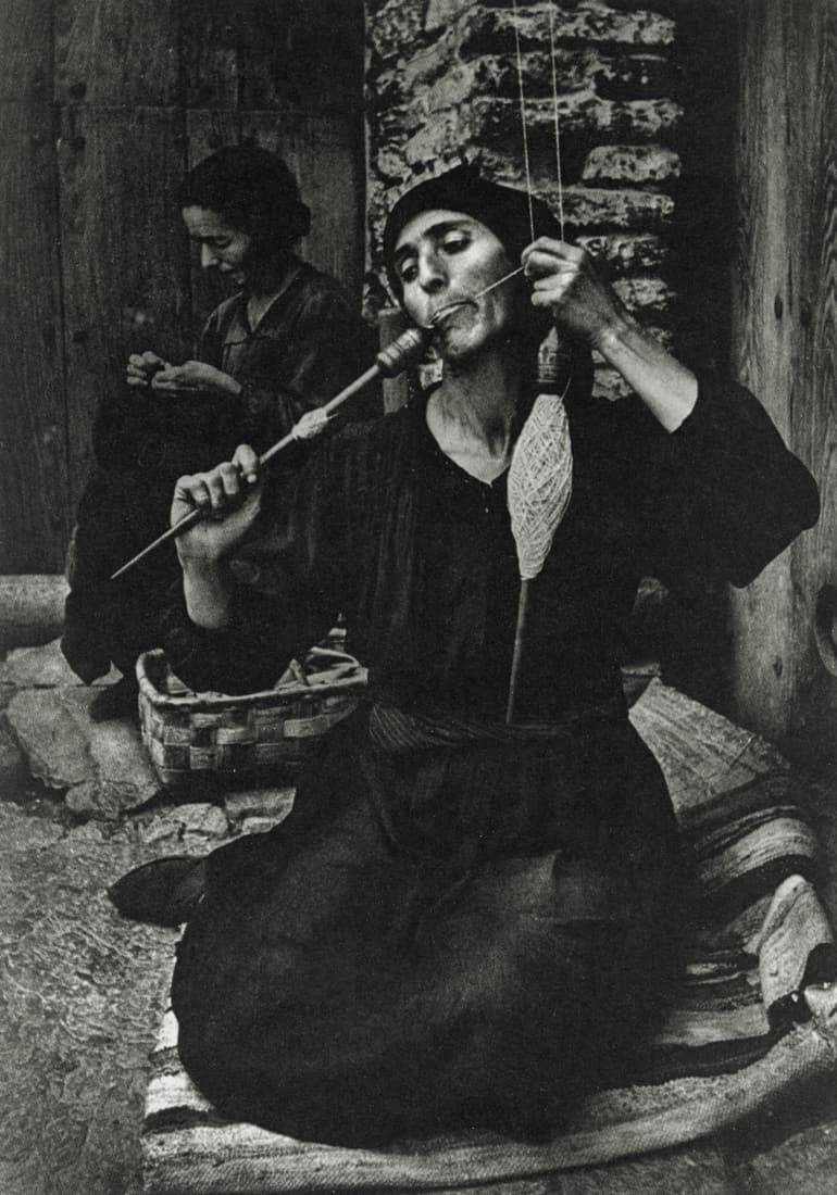 W. EUGENE SMITH - A Woman Spinning, Spain, 1951: Artist: W. Eugene Smith Title: A Woman Spinning, Spain, 1951 Medium: Sheet Fed Gravure, 1989, Switzerland Dimensions: 5.65x8.05" Description: Heat Wax Mounted on 8.5x11" Conservation Board Artist Bio: