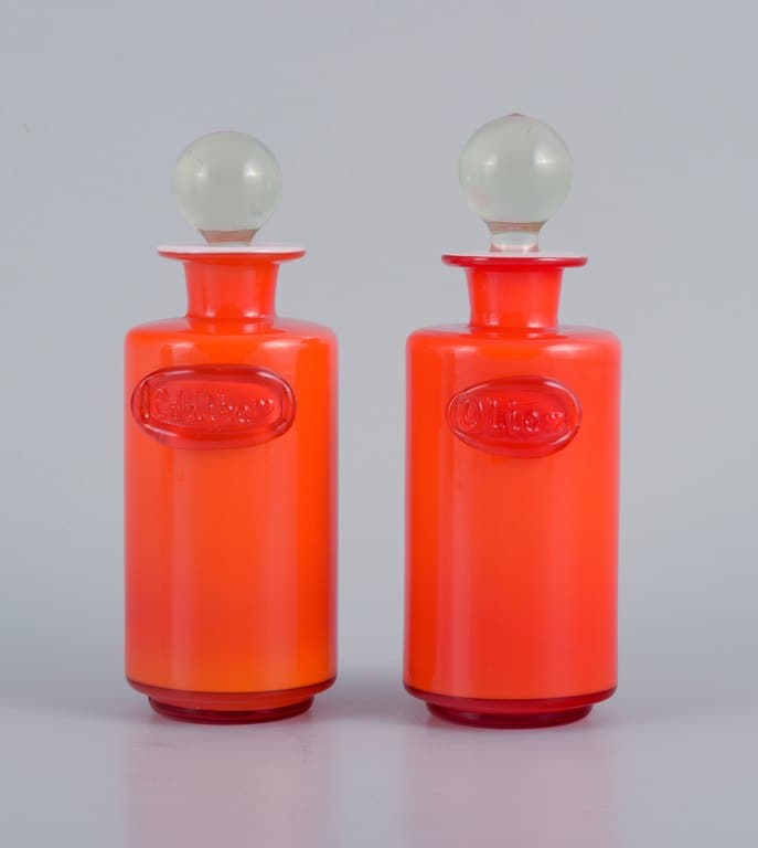 Michael Bang for Holmegaard. Oil and vinegar containers in orange and white art glass.: Michael Bang for Holmegaard. Oil and vinegar containers in orange and white art glass. 1960s. In perfect condition. Dimensions: D 5.5 x H 14.5 cm. Reserve: $196.00 Shipping: Domestic: Shipping rates a