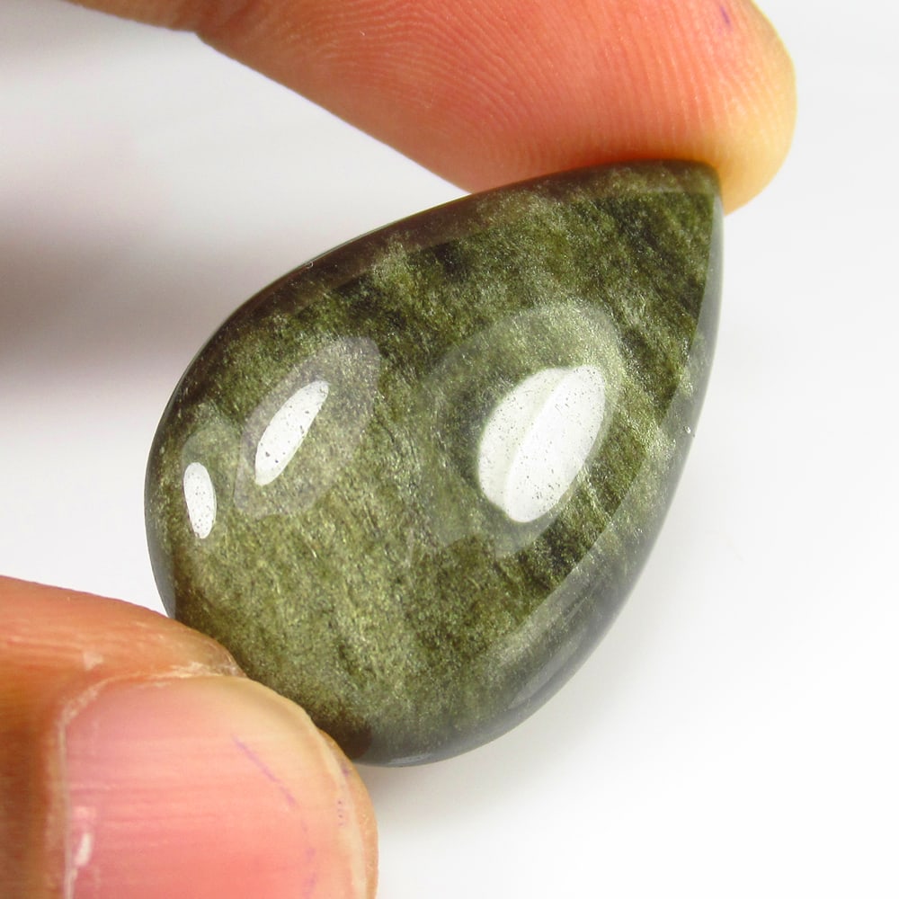 16.91 Ct - Natural Obsidian: No Reserve! Title: 16.91 Ct - Natural Obsidian Additional Information: Gemstone Gemstones: Obsidian Carat Weights: 16.91 Size/Dimensions: 30.0 x 18.9 x 6.4 mm Additional Information: Pieces : 1 No's /
