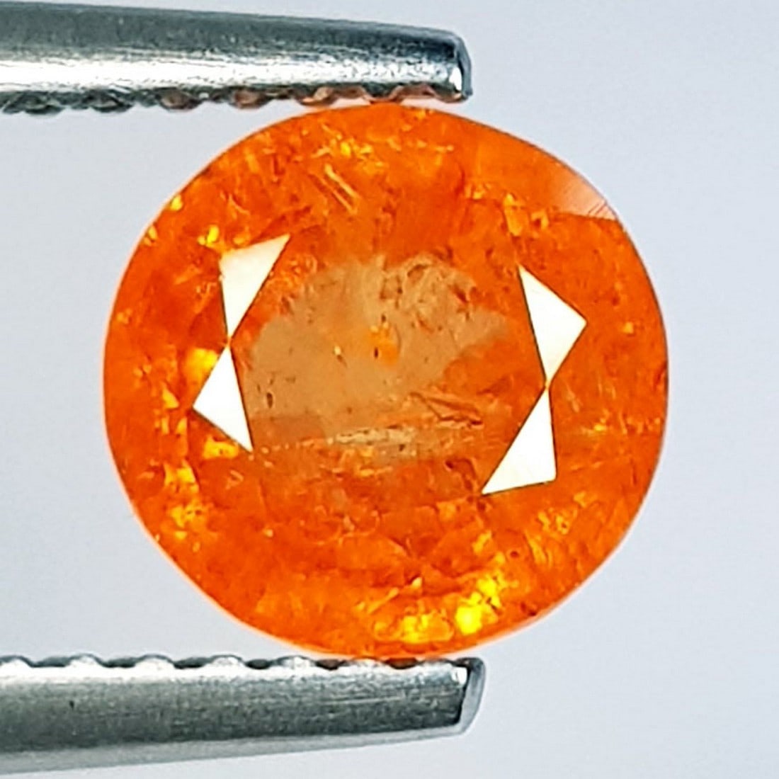 2.43 ctz Fine Fanta Orange Natural Mandarin Garnet: No Reserve! Title: 2.43 ctz Fine Fanta Orange Natural Mandarin Garnet Color/Clarity: Orange / VS Gemstone: Spessartite Garnet Carat Weights: 2.43 Size: 7.00 x 7.00 x 5.00 Additional Information: Round