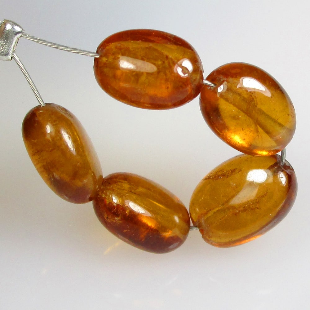 6.71 Ctw Natural 5 Hessonite Garnet Dumble Beads: No Reserve! Title: 6.71 Ctw Natural 5 Hessonite Garnet Dumble Beads Stone Clarity: Transparent Gemstones: Natural Garnet Beads Carat Weights: 6.71 Size/Dimensions: 5.2x3.8- 5.6x3.5 mm / 5 Pc's Additio
