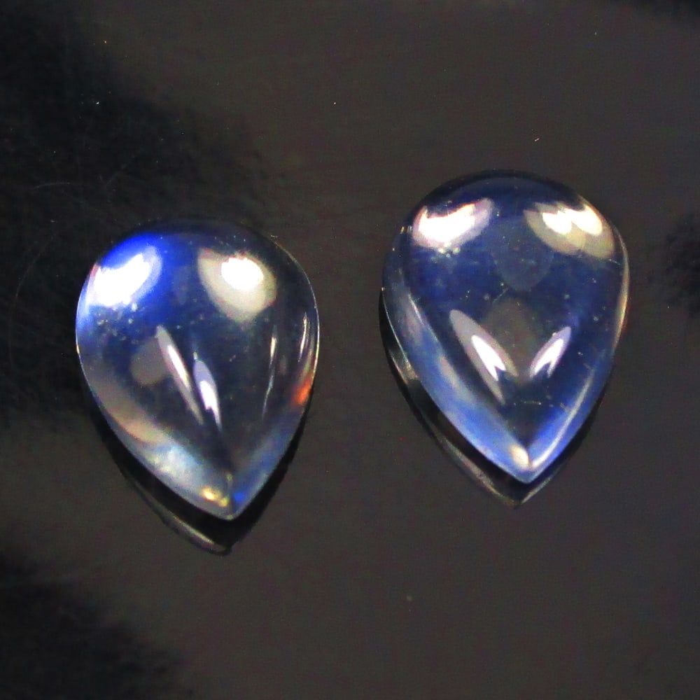 1.63 Ctw Natural Blue Moonstone Pear Pair: No Reserve! Title: 1.63 Ctw Natural Blue Moonstone Pear Pair Stone Clarity: Translucent Gemstones: Natural Moonstone Carat Weights: 1.63 Size/Dimensions: 8.00 x 6.00 x 2.60 mm / 2 Pc's Additional Info