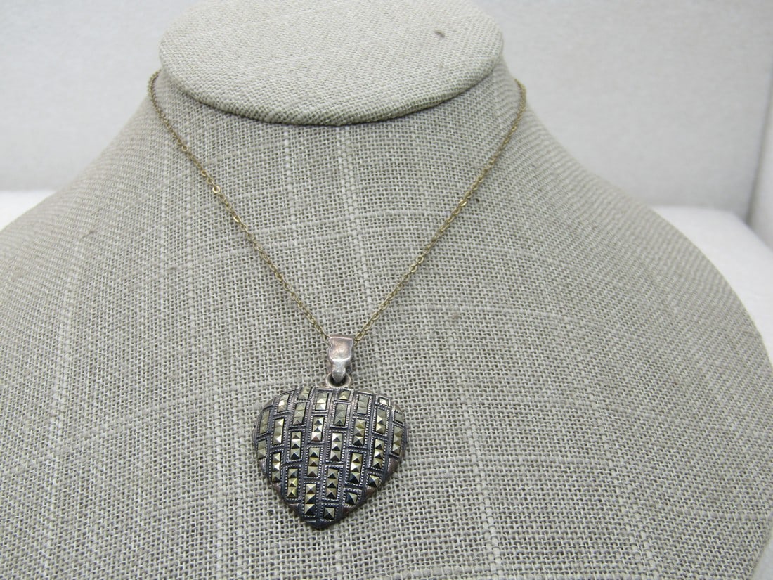 Vintage Sterling Marcasite Heart Necklace, 18", Signed CW: Vintage Sterling Heart Necklace, 18", Signed CW. Pendant is appx. 1.5" long and 1" wide with a swing bail signed .925 and CW. This has marcasite-like Accents on the domed heart. The pendant tests as s