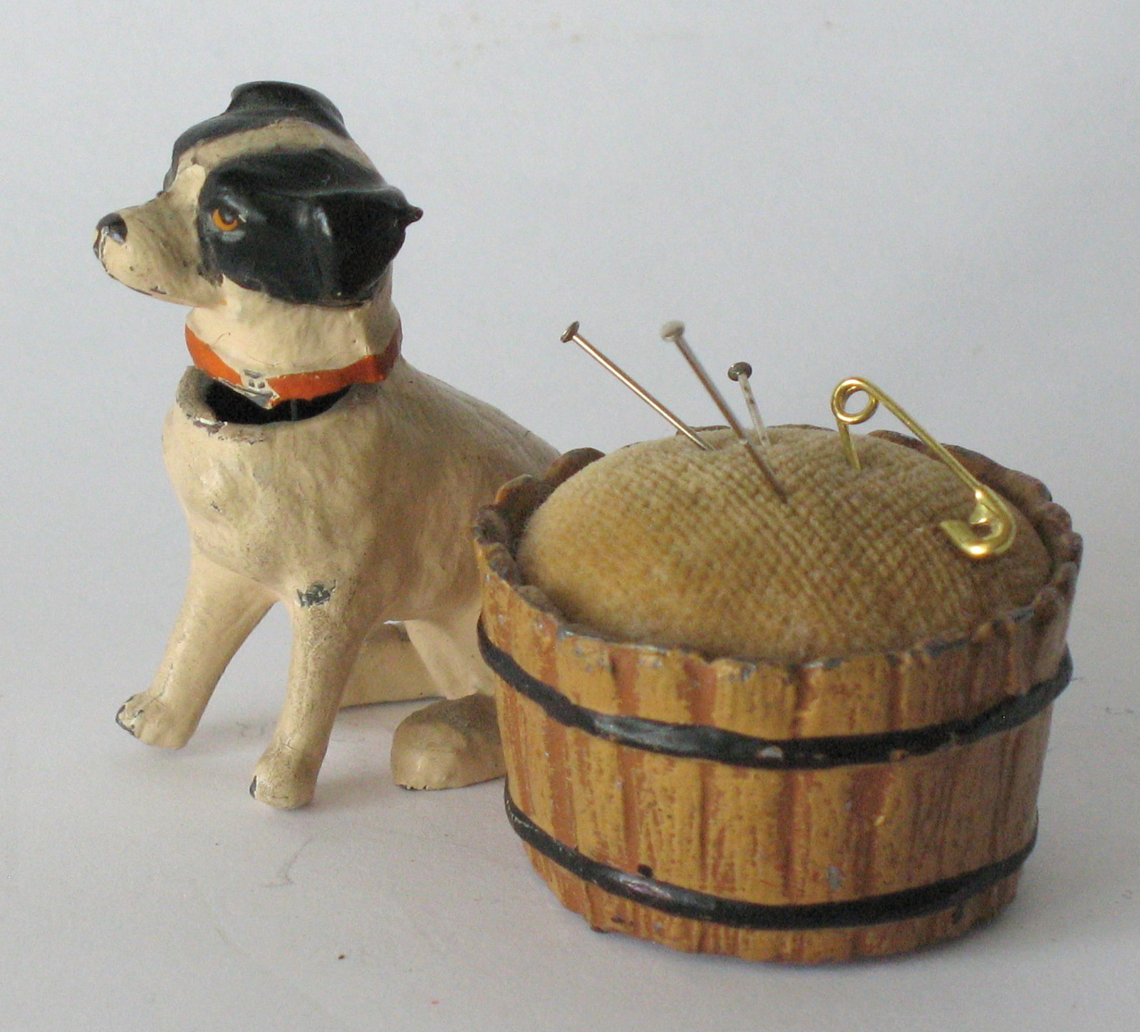 Antique cast metal jack Russel pincushion.: Title: Antique cast metal jack Russel pincushion. Date/Period: 1930's Dimension: 2” x 2 1/2” Additional Information: Nice antique cast metal Jack Russel sewing pin cushion in great origina