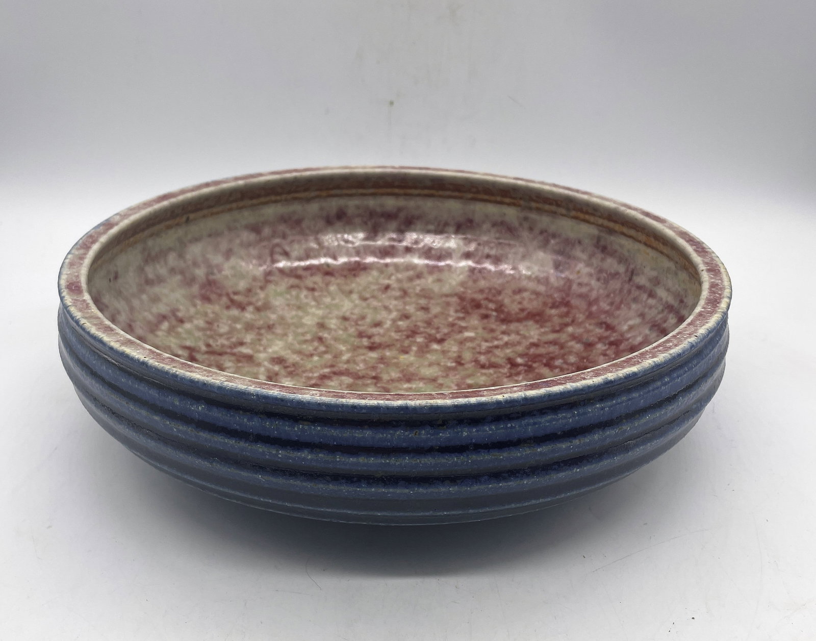 Art pottery low bowl possibly Fulper: Title: Art pottery low bowl possibly Fulper Date/Period: unknown Dimension: 10" diameter Material: pottery Additional Information: Art pottery low bowl possibly Fulper. The coloration makes me believe
