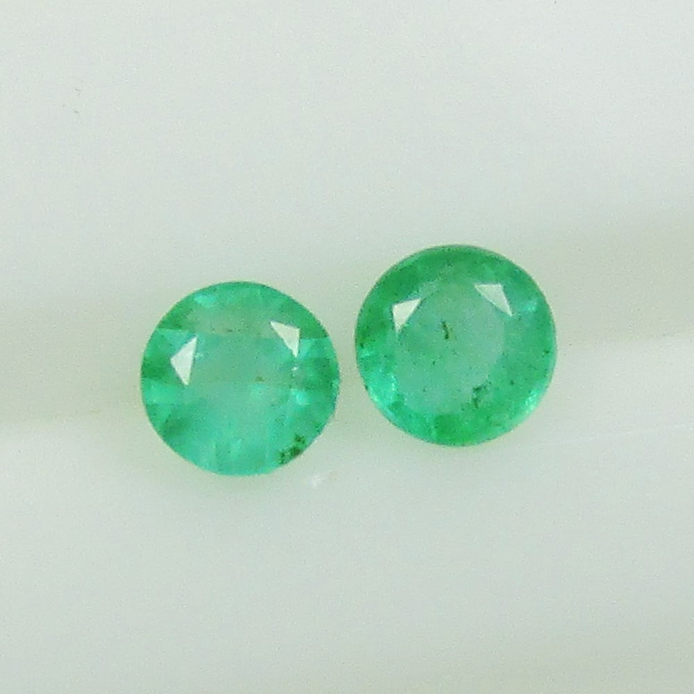 0.74 Ctw Natural Zambian Emerald Round Pair: No Reserve! Title: 0.74 Ctw Natural Zambian Emerald Round Pair Stone Clarity: SI Gemstones: Natural Emerald Carat Weights: 0.74 Size/Dimensions: 4.70 x 4.70 x 3.10 mm / 2 Pc's Additional Information: 