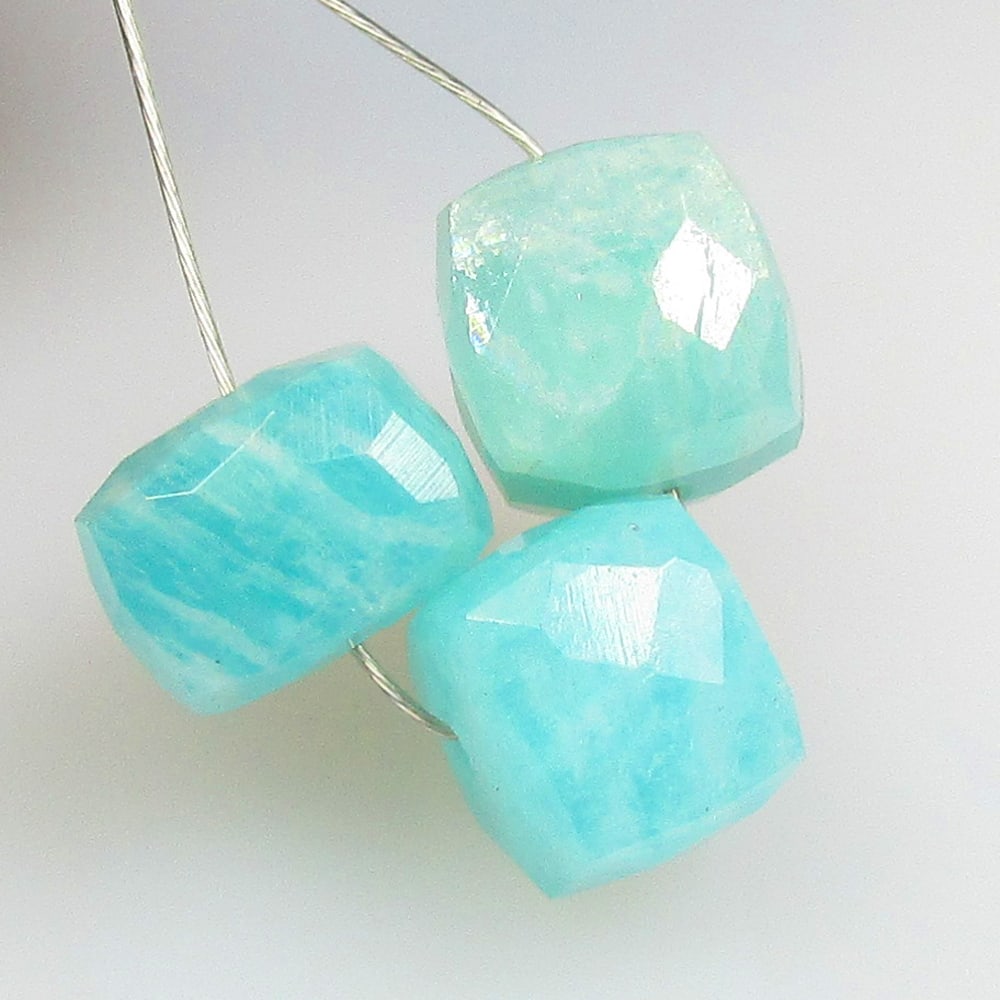 7.27 Ctw Natural 3 Drilled Amazonite Square Beads: No Reserve! Title: 7.27 Ctw Natural 3 Drilled Amazonite Square Beads Stone Clarity: Opaque Gemstones: Natural Amazonite Beads Carat Weights: 7.27 Size/Dimensions: 6.5x6.5 - 7.0x7.0 mm / 3 Pc's Additio