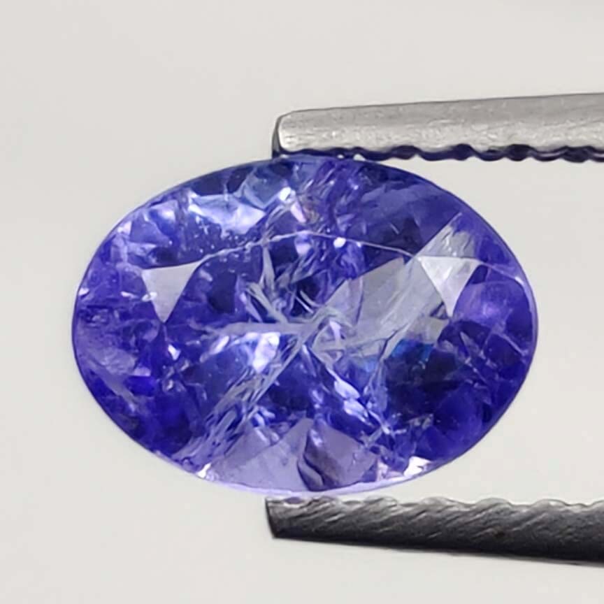 1.10 Ct "Good Quality" Natural Tanzanite: No Reserve! Title: 1.10 Ct "Good Quality" Natural Tanzanite Additional Information: Gemstones: Natural Tanzanite Carat Weights: 1.10 ct Size/Dimensions: 7 X 5 mm Origin : Tanzania Materials & Techniqu