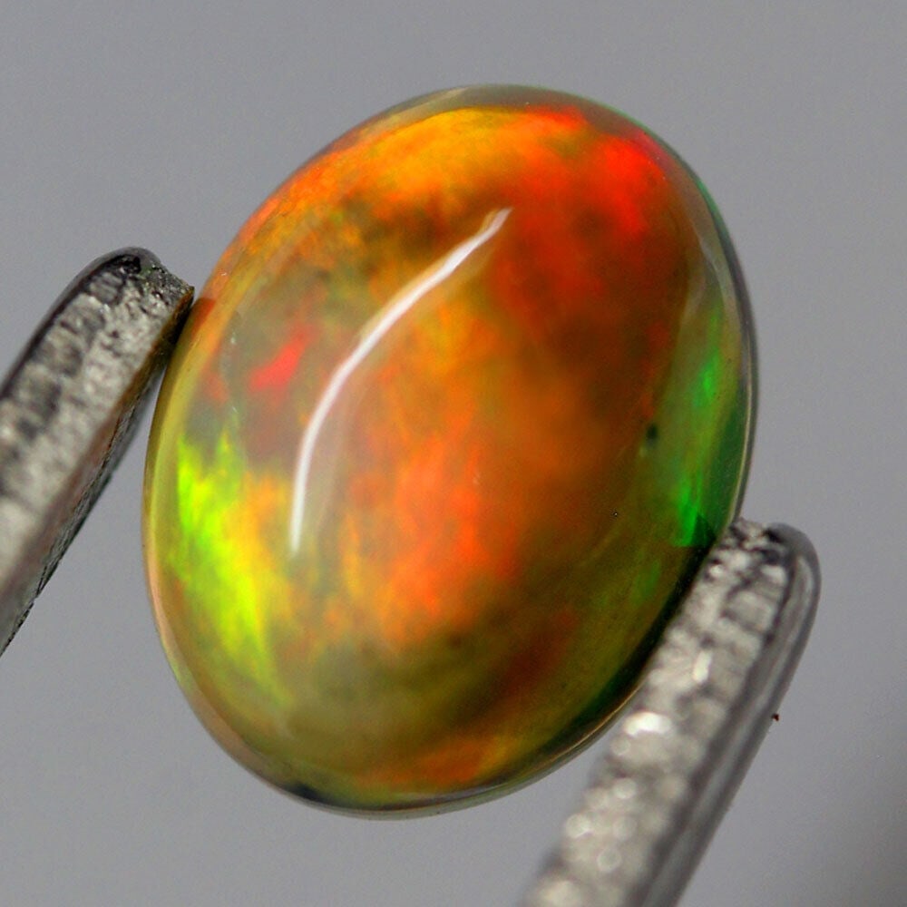 Natural Unheated Multicolor Welo Ethiopian Opal Cabochon Oval Shape (1 of 3)