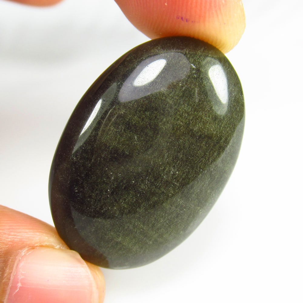 34.63 Ct - Natural Obsidian: No Reserve! Title: 34.63 Ct - Natural Obsidian Additional Information: Gemstone Gemstones: Obsidian Carat Weights: 34.63 Size/Dimensions: 33.0 x 24.0 x 6.8 mm Additional Information: Pieces : 1 No's /