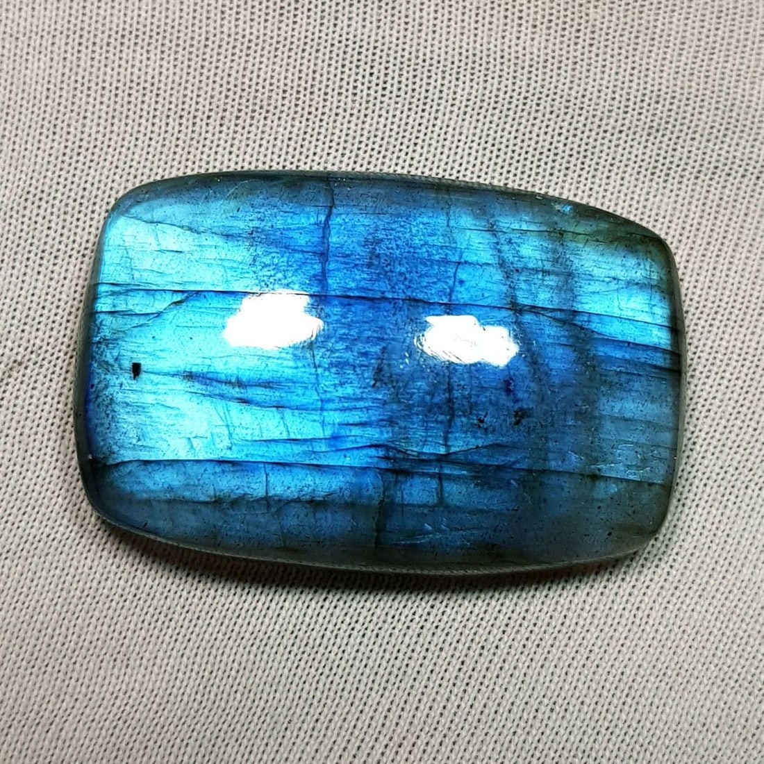 48.83 Ctz Natural Blue Labradorite: No Reserve! Title: 48.83 Ctz Natural Blue Labradorite Color/Clarity: Bluish / Semi Transparent Gemstone: Labradorite Carat Weights: 48.83 Size: 31.85 x 20.95 x 7.40 Additional Information: Octagon Cab