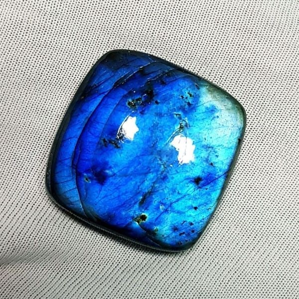 44.69 Ctz Natural Blue Labradorite: No Reserve! Title: 44.69 Ctz Natural Blue Labradorite Color/Clarity: Bluish / Semi Transparent Gemstone: Labradorite Carat Weights: 44.69 Size: 26.10 x 25.50 x 6.70 Additional Information: Octagon Cab